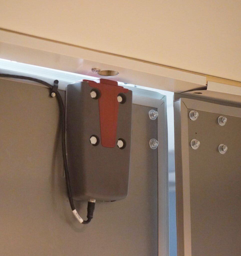 close up of power in lock device mounted inside a closed container