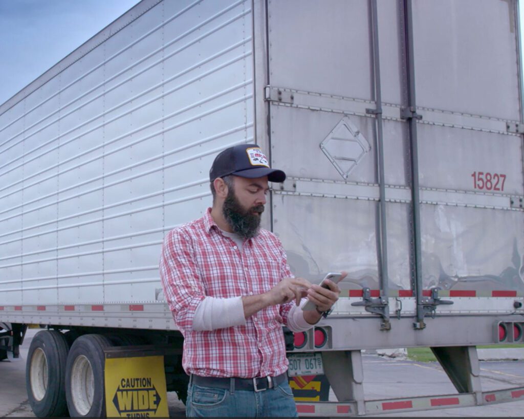 Client using Power In-Locks phone app to lock trailer via bluetooth and telematics